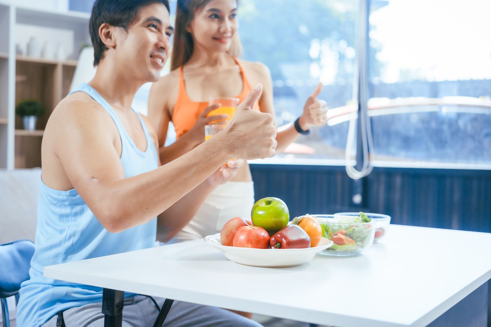 m_a-happy-young-couple-in-sportswear-sits-on-the-sof-2025-02-16-07-18-49-utc